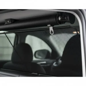 Close-up of a retractable mechanism for a rear windscreen sun shade, showing the smooth pull-down operation.